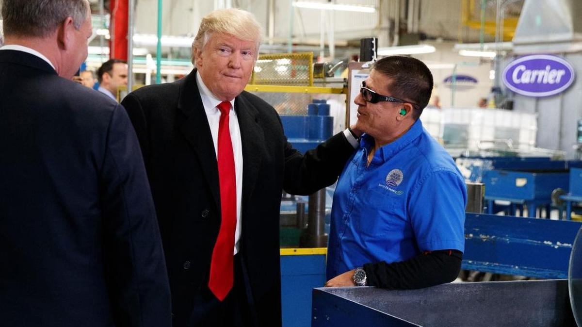 President-elect Donald Trump talks with workers during a visit to the Carrier factory, Thursday, Dec. 1, 2016, in Indianapolis, Ind.