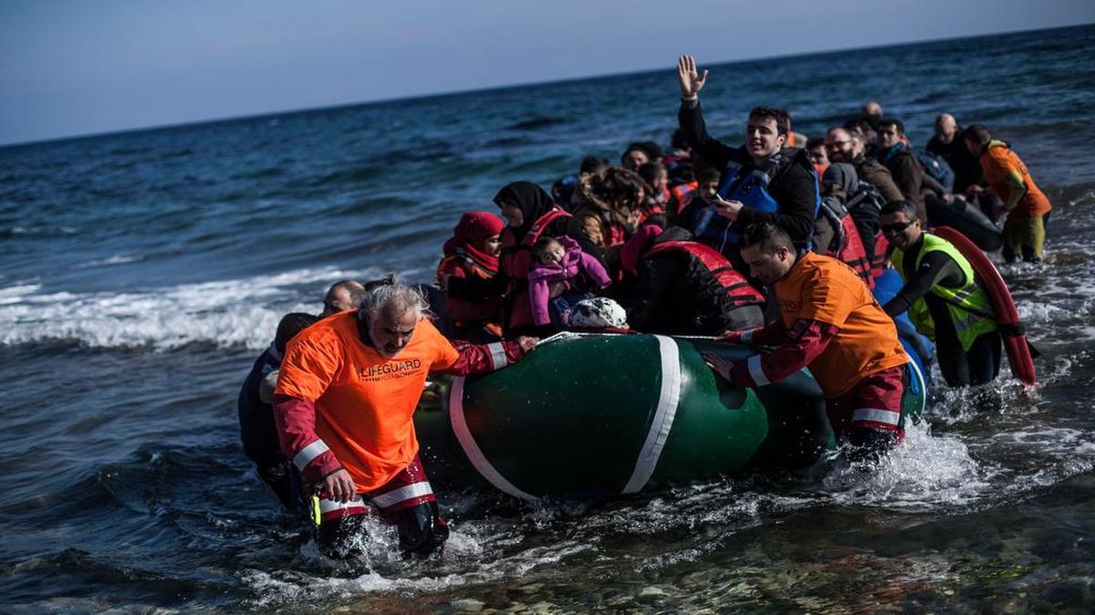 Syrian refugees aboard a dinghy arrive at the Greek northeastern island of Lesbos, Saturday, Feb. 20, 2016. President Barack Obama wants to resettle 10,000 Syrians by Sept. 30.