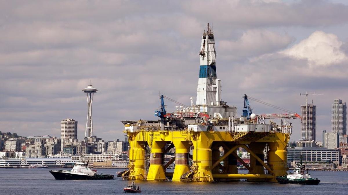
FILE - In this May 14, 2015, file photo, the Royal Dutch Shell Arctic oil drilling rig Polar Pioneer is towed toward a dock in Elliott Bay in Seattle. (AP Photo/Elaine Thompson, File)
