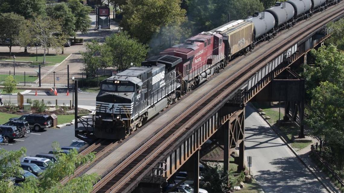 Norfolk Southern and Canadian Pacific locomotives lead an empty oil train west at Richmond, Va., on Oct. 14, 2014. The Canadian railroad last week made public its offer to take over Norfolk Southern. The $28 billion deal, if approved by shareholders and regulators, would create the largest railroad in North America.
