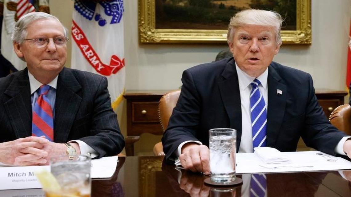 President Donald Trump, flanked by Senate Majority Leader Mitch McConnell, R-Ky., and House Speaker Paul Ryan, R-Wis., March 1, 2017, in the Roosevelt Room of the White House in Washington.
