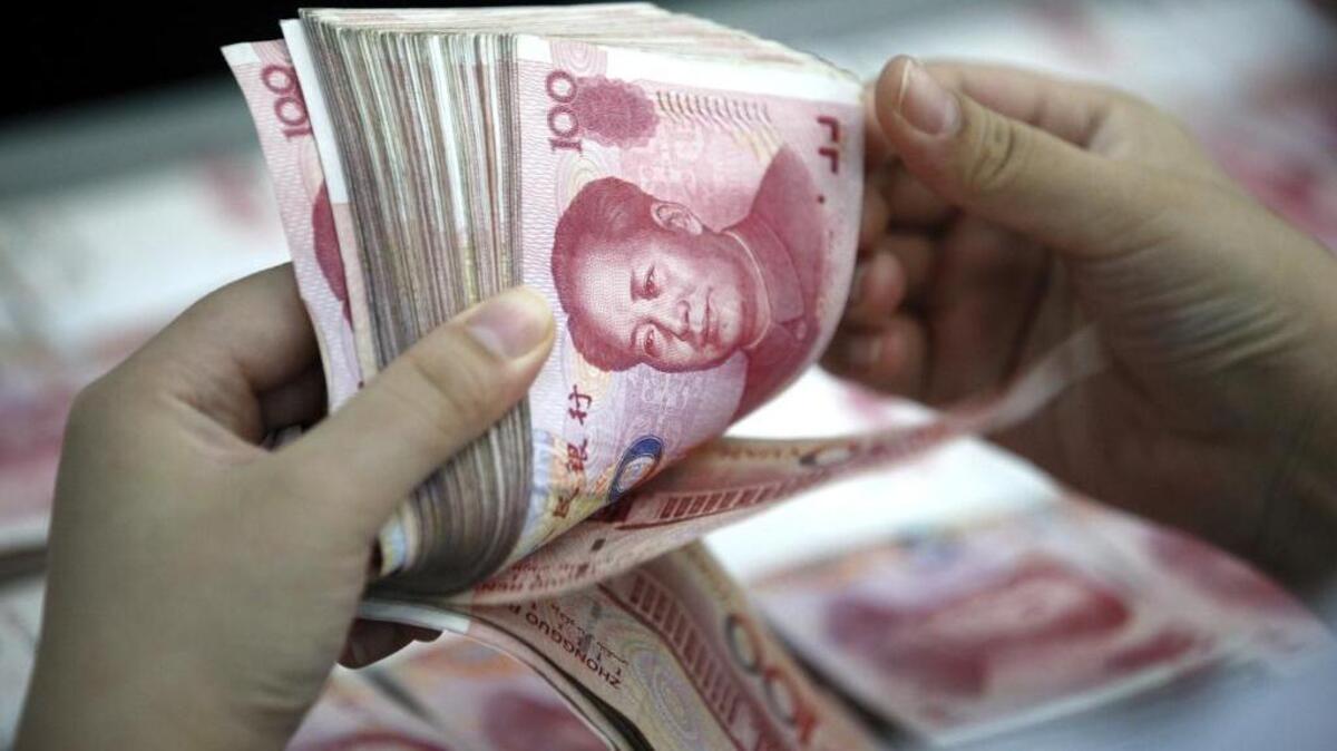 
A bank clerk counts renminbi banknotes in a bank branch in central China's Anhui province Wednesday as world frets about quality of nation’s economy. 
