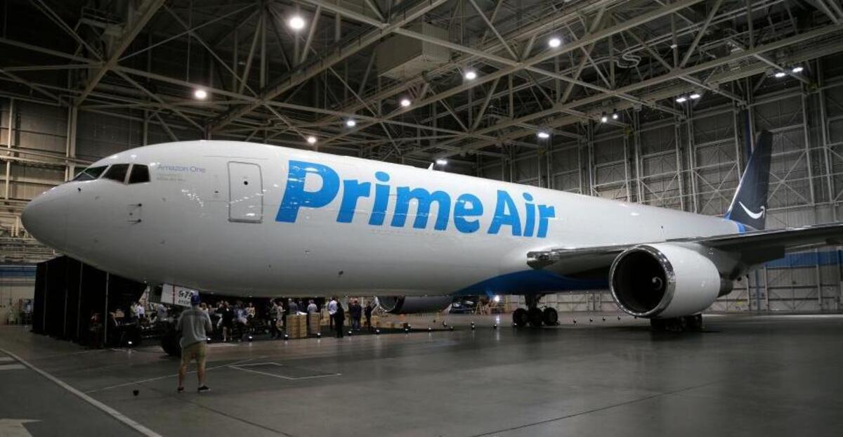 A Boeing 767, an Amazon.com "Prime Air" cargo plane is parked on display Thursday, Aug. 4, 2016, in a Boeing hangar in Seattle. Amazon unveiled its first branded cargo plane Thursday, one of 40 jetliners that will make up Amazon's own air transportation network of 40 Boeing jets leased from Atlas Air Worldwide Holdings and Air Transport Services Group Inc., which will operate the air cargo network.