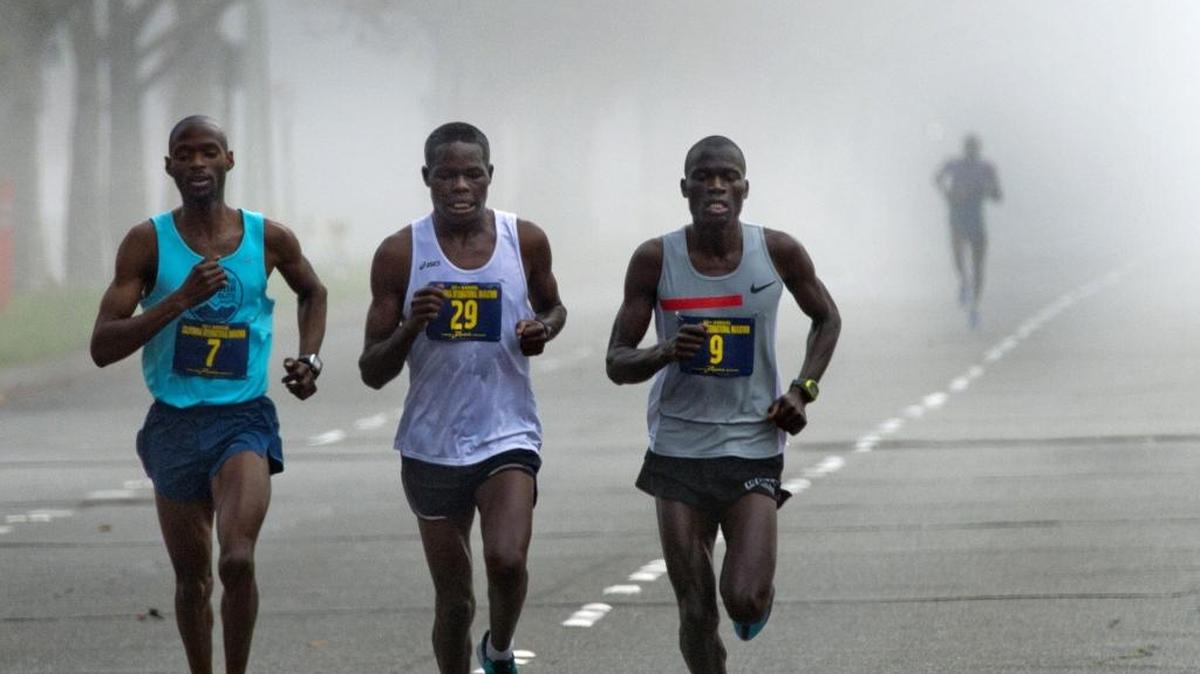 
Competitors in the California International Marathon run through the fog on Dec. 7, 2014. Union Pacific has granted safe passage for runners across its track in Midtown Sacramento for this year’s race and will sponsor the event.
