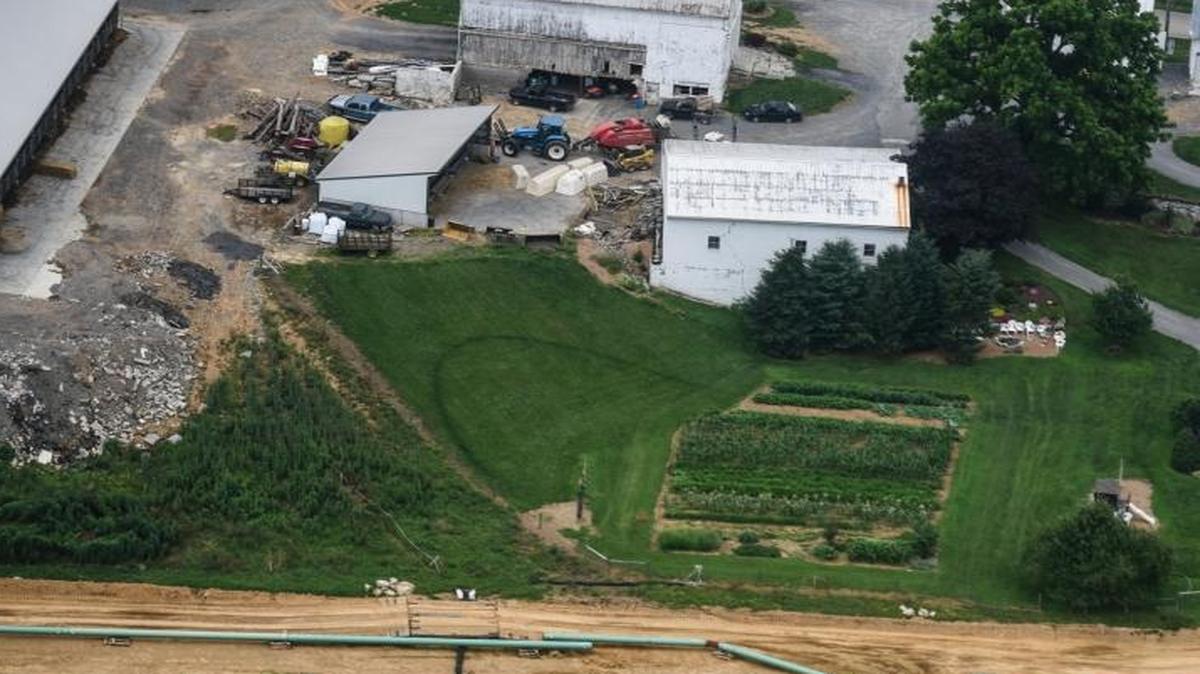 Pipes for the Sunoco Mariner East pipeline sit next to a farm in South Lebanon Township, Pa., on July 5. Sunoco is paying to connect municipal water to about 30 Pennsylvania households whose wells were contaminated by the pipeline construction. Several other pipelines - many designed to carry natural gas from West Virginia and surrounding states - are in the works, awaiting federal approval.