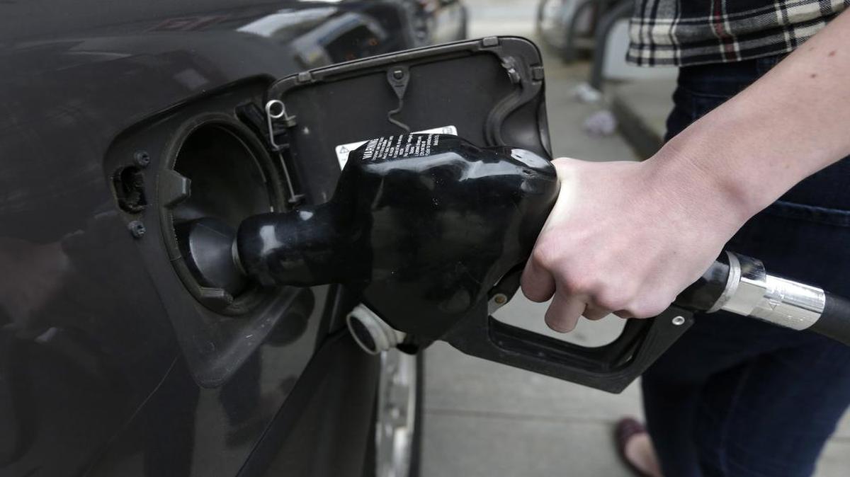 
In this Tuesday, April 29, 2014, photo a customer fills her car with fuel at a gas station.

