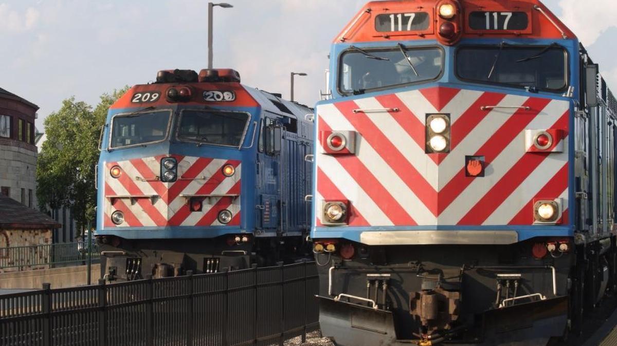 
Metra commuter trains pause at Aurora, Ill., on Aug. 19, 2014, before returning to Chicago. A monthlong shutdown of rail service could force more than 38 million commuters to drive to work or stay home.
