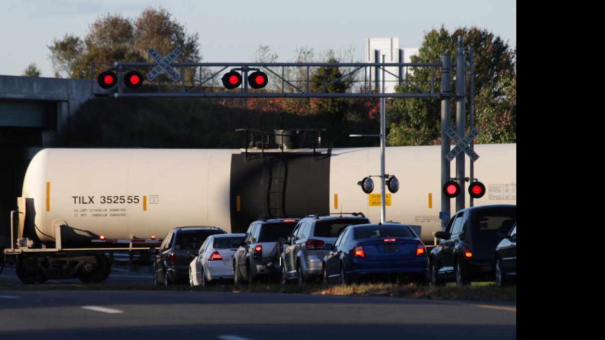 
A Norfolk Southern oil train crosses a state highway as it rolls into the refinery at Delaware City, Del., on Oct. 26, 2014. Google Maps will begin warning drivers as they approach railroad crossings using data from the Federal Railroad Administration.
