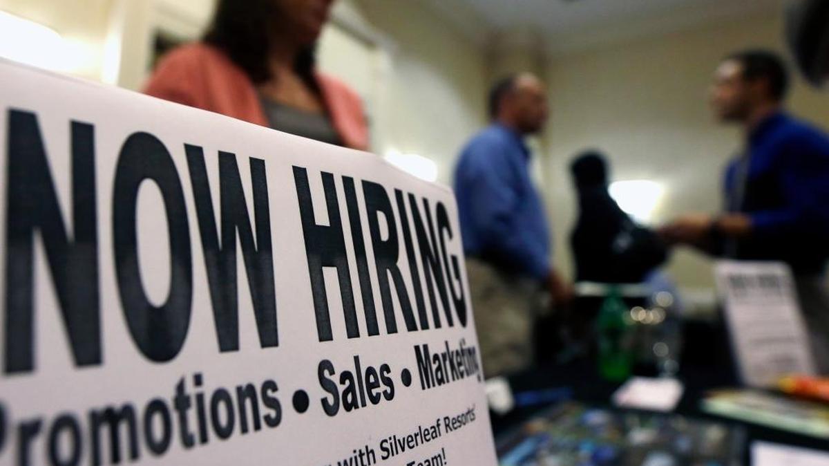 
 In this Thursday, Oct. 25, 2012, file photo, a sign attracts job-seekers during a job fair at the Marriott Hotel in Colonie, N.Y. 
