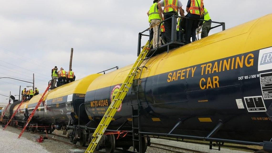 Virginia firefighters learn about the DOT-105J, a type of tank car used to transport chlorine, during a training course at a CSX rail yard in Richmond, Va., on Oct. 3, 2015.