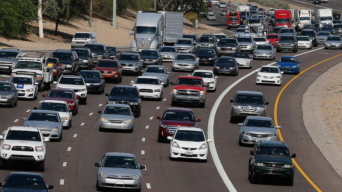 
FILE - In this June 24, 2015, file photo, afternoon rush our traffic moves along a highway in Phoenix. 
