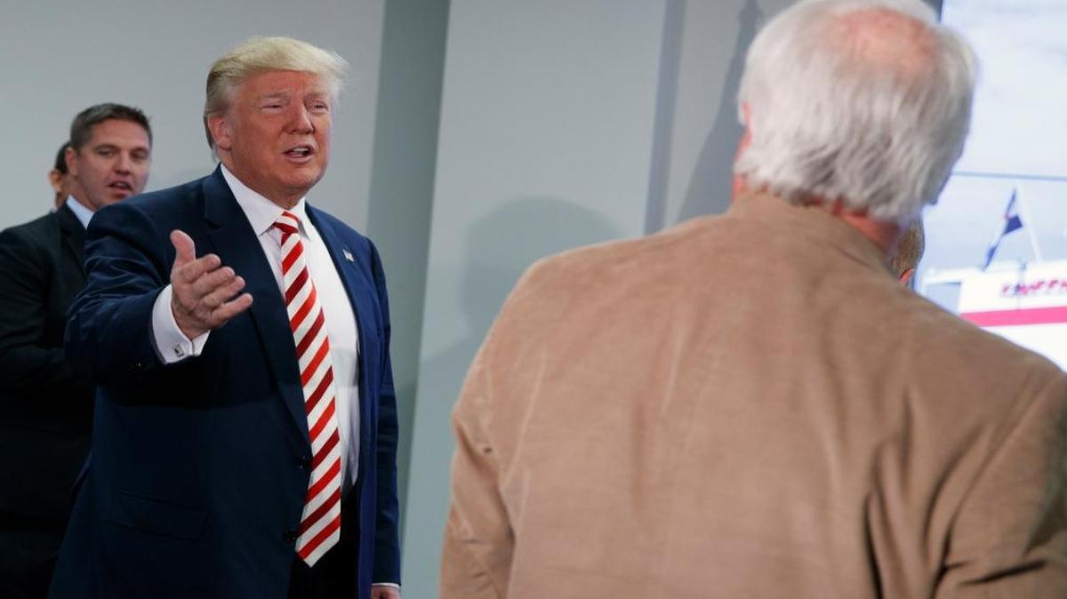 Republican presidential candidate Donald Trump arrives for a roundtable meeting with energy executives, Tuesday, Oct. 4, 2016, in Denver.