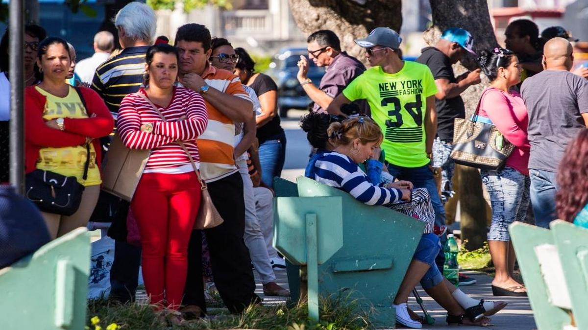 People wait for visas outside the United States embassy in Havana, Cuba, the day after Republican presidential candidate Donald Trump defeated Democrat Hillary Clinton in the U.S. general election Wednesday, Nov. 9, 2016. Trump's victory caused concern in Cuba, over his threat to roll back President Barack Obama's normalization of relations unless Cuban President Raul Castro agrees to more political freedoms.