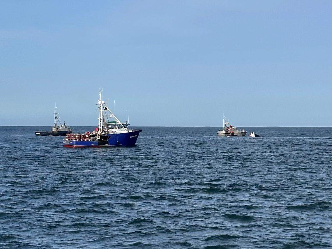The sinking fishing boat is pictured.