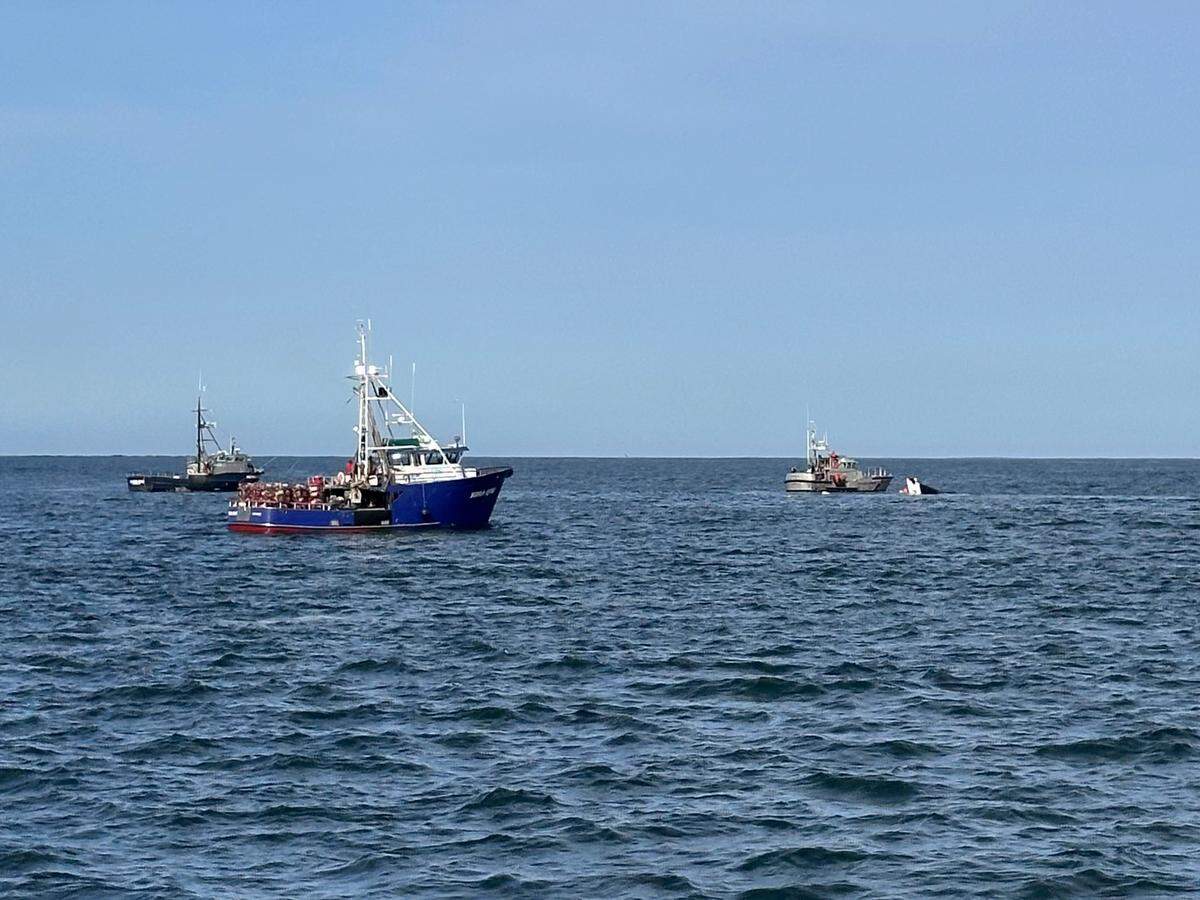 The sinking fishing boat is pictured.