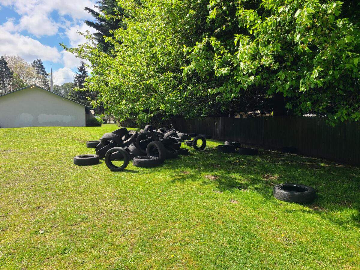 The tires were dumped behind the church, in its grassy field.
