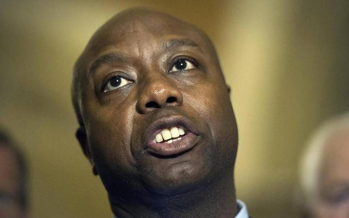 Sen. Tim Scott, R-S.C., speaks with reporters about removing the Confederate Battle Flag from atop the South Carolina State Capitol following a policy luncheon at the U.S. Capitol in Washington, June 23, 2015.