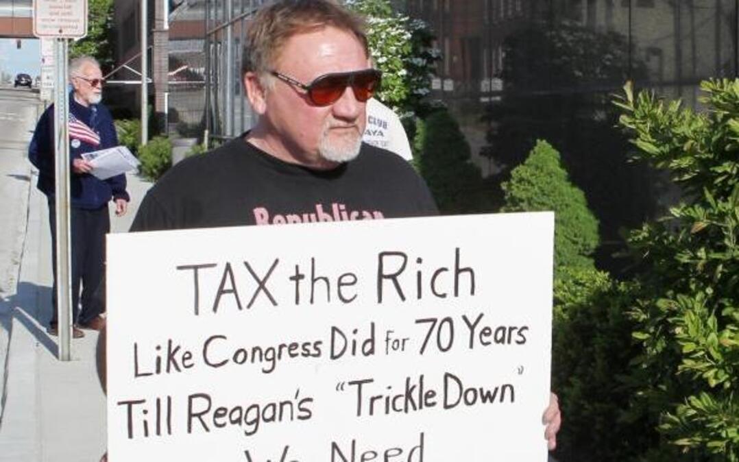 James Hodgkinson of Belleville protests outside of the United States Post Office in Downtown Belleville in this file photo. Hodgkinson is part of the “99%” team drawing attention to the disproportionate amount of money and political power the top 1 percent of Americans have acquired. Also protesting outside of the post office where members of the Communications Workers of America Local 4217 they were drawing attention to the low percentage of taxes paid by AT&T.