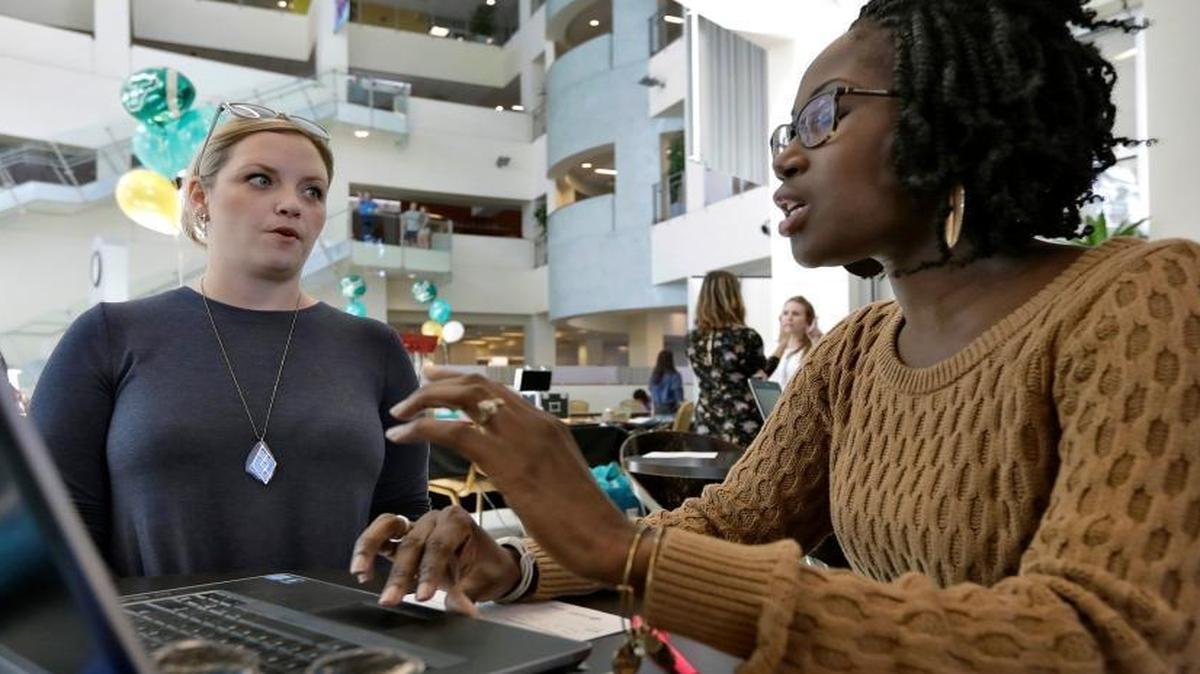 In this Tuesday, Jan. 24, 2017, file photo, Xonjenese Jacobs, right, helps Kristen Niemi sign up for the Affordable Care Act during a healthcare expo at the University of South Florida, in Tampa, Fla. The Affordable Care Act’s fate is unclear. President Donald Trump has vowed to repeal it, but lawmakers have yet to reach an agreement on a replacement, leaving millions of people wondering how to deal with the ACA's uncertain future.