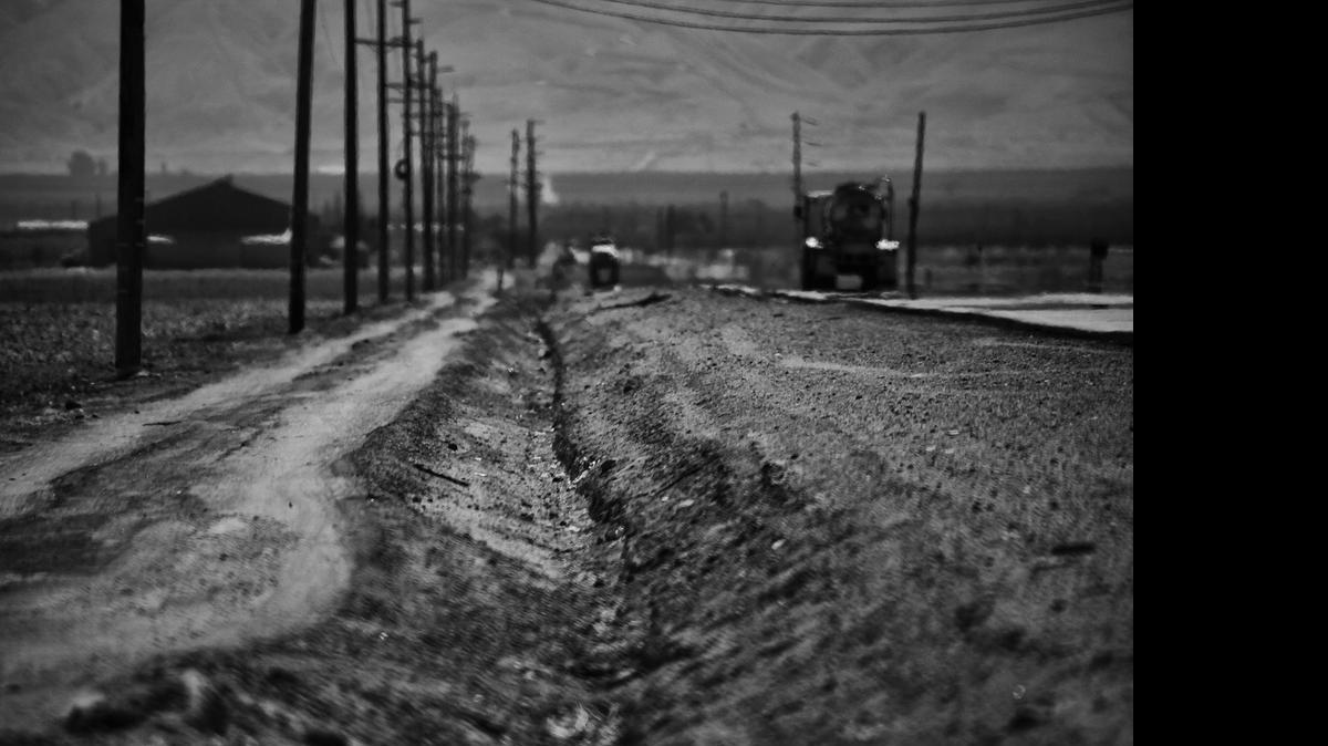 
Waves of heat rise above a dried out irrigation canal running along a road south west of Stratford, Calif., on Sept. 30, 2014. Stratford, in California's Central, is one of many towns in the region that is being sucked dry by the state's historic drought. Businesses have shuttered and fled as have many residents. The town has no gas stations, restaurants, coffee shops or even a hardware store.
