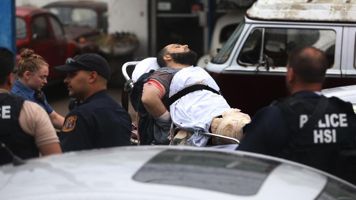 Ahmad Khan Rahami is taken into custody after a shootout with police Monday, Sept. 19, 2016, in Linden, N.J. Rahami was wanted for questioning in the bombings that rocked the Chelsea neighborhood of New York and the New Jersey shore town of Seaside Park.