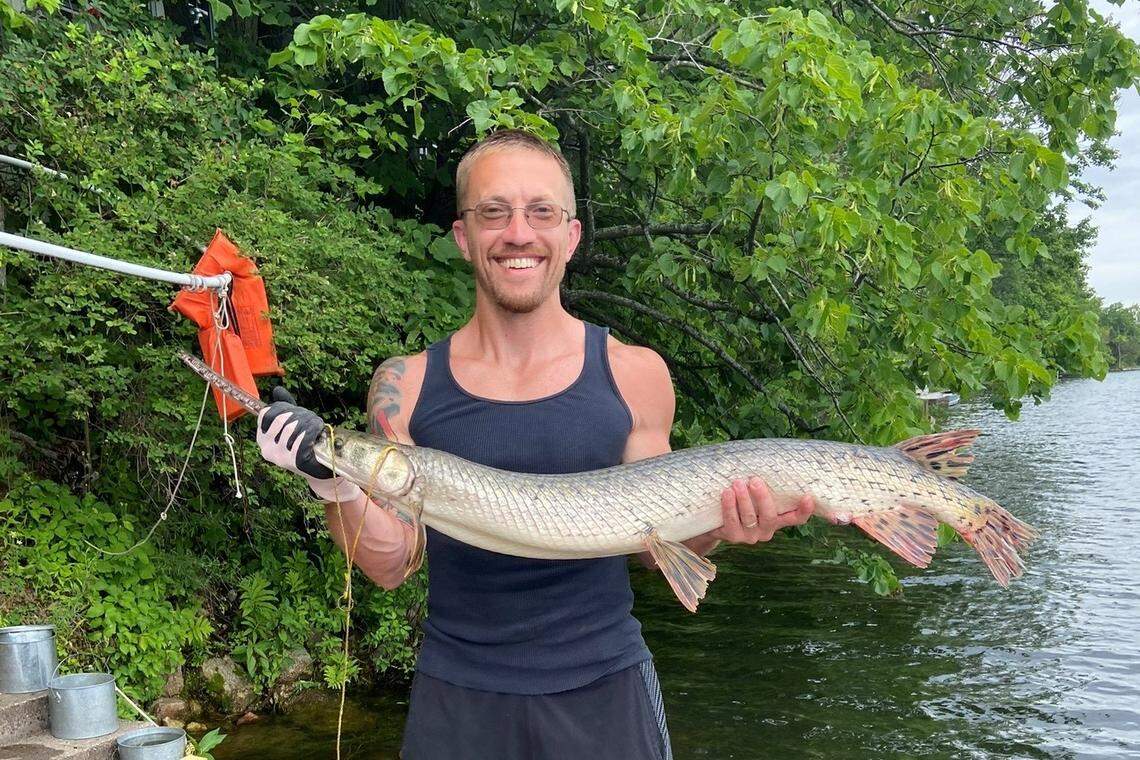 Chuck Zimmerman holds his catch: a longnose gar.