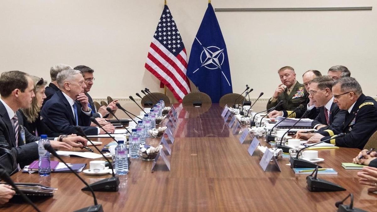 Defense Secretary James Mattis, center left, meets with members of the U.S. mission at NATO headquarters in Brussels, Wednesday, Feb. 15, 2017.
