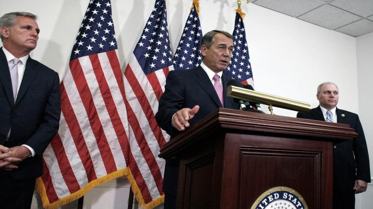 House Speaker John Boehner of Ohio, center, flanked by House Majority Leader Kevin McCarthy of California, left, and House Majority Whip Steve Scalise of Louisiana, explains the budget deal to reporters Tuesday.