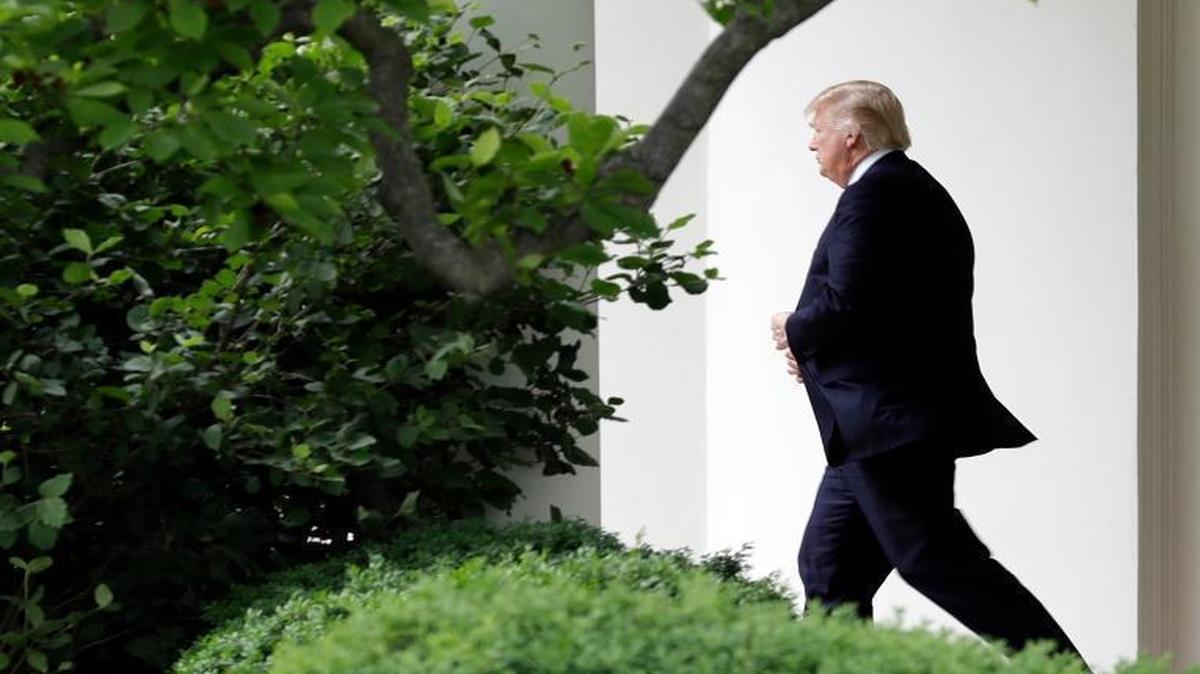 President Donald Trump walks from the Oval Office to the Marine One helicopter Thursday, May 4, 2017, as he leaves the White House in Washington, en route to New York City. Trump fired FBI Director James Comey on Tuesday just 24 hours after his former top national security aide, Michael Flynn – and, by extension, his own diligence concerning Flynn’s behavior, was publicly put through the wringer – raises questions of political payback.
