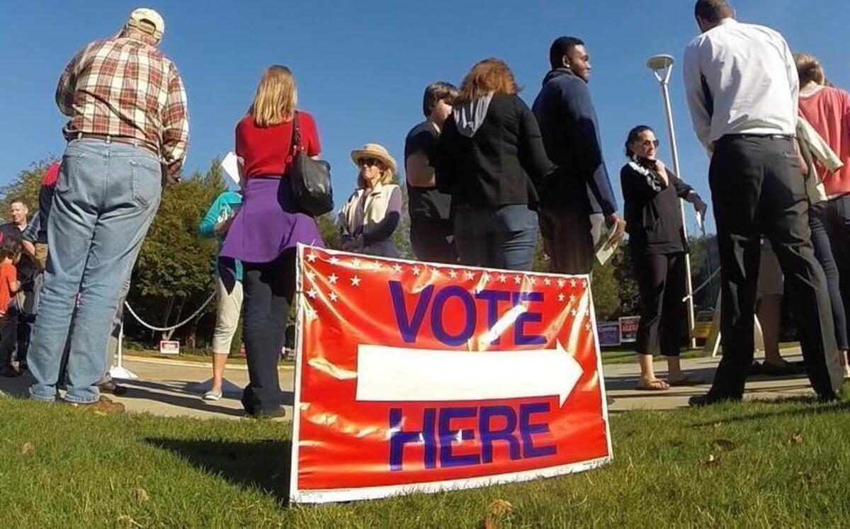 Voters wait in line for early voting at the Lake Lynn Community Center in Raleigh, N.C. Wednesday, October 26, 2016.