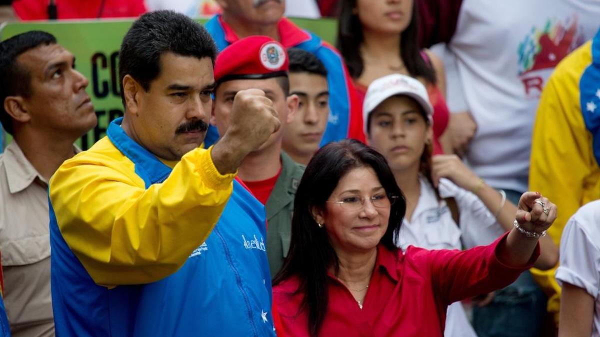 Venezuela's President Nicolas Maduro and first lady Cilia Flores at a march in Caracas, Venezuela. Two Flores nephews will return to federal court Thursday on charges of conspiring to smuggle 800 kilograms of cocaine into the U.S.