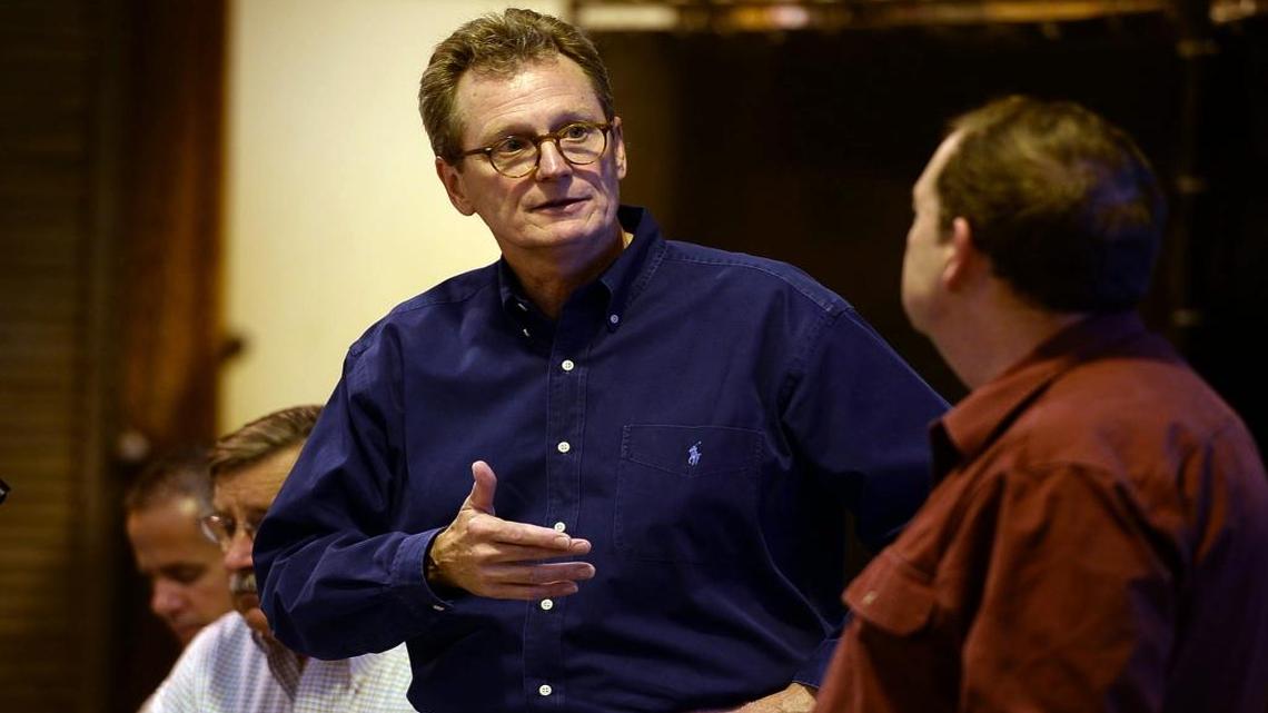 In this 2013 photo, Westlands Water District's Tom Birmingham speaks with Ron Milligan (right), operations manager for the Central Valley Project, which is run by the U.S. Bureau of Reclamation.