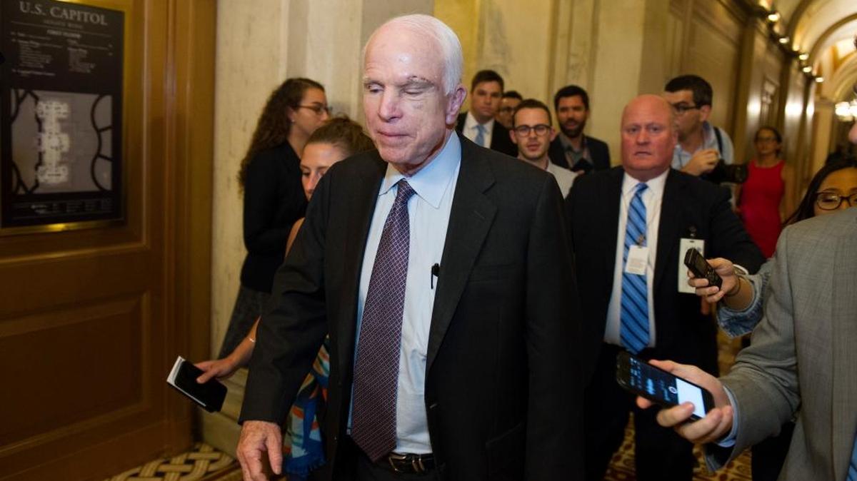 Sen. John McCain, R-Az., is pursued by reporters after casting a 'no' vote on a a measure to repeal parts of former President Barack Obama's health care law, on Capitol Hill in Washington, Friday, July 28, 2017. Conservative activists are frustrated with Republican inability to repeal the law.