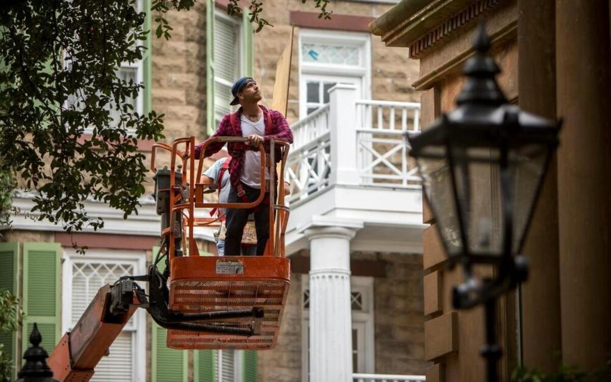Nathan Ecker of Landmark Preservation uses a lift to place plywood over the windows of the Historic Owen-Thomas house during storm preparations for Hurricane Matthew, Thursday, Oct. 6, 2016, in Savannah, Ga. The Owens-Thomas house is one of the best preserved structures in the Landmark Historic District.