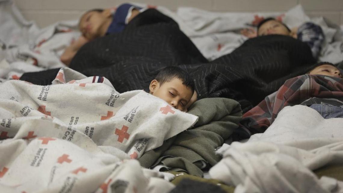 This file photo shows detainees sleeping in a holding cell at a U.S. Customs and Border Protection processing facility on June 18, 2014, in Brownsville,Texas.