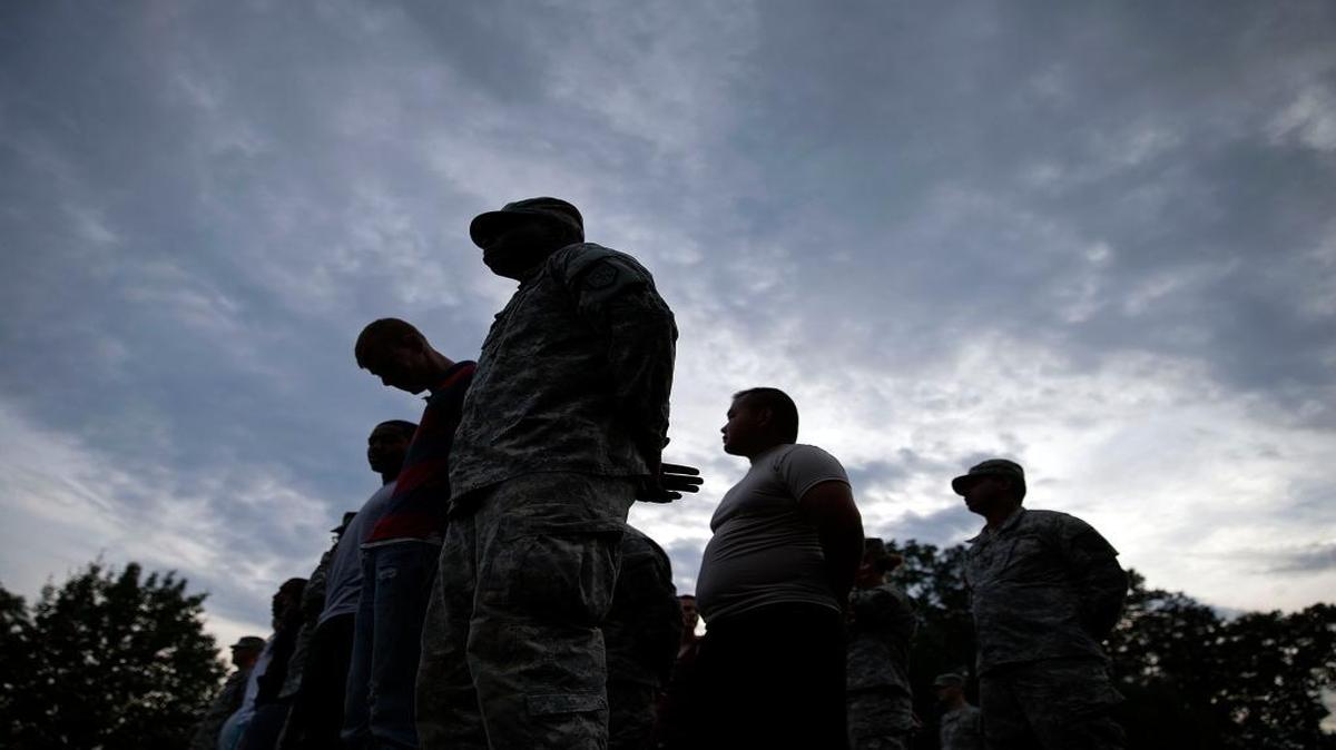 Pvt. Norman Davis, of Bamberg, S.C., front, stands during roll call with fellow soldiers from the Georgia National Guard 876th Vertical EN Company, on the eve the unit deploys to Afghanistan, Thursday, May 29, 2014, in Toccoa, Ga. The unit's deployment marks the last for the Georgia Army National Guard to Afghanistan as the military looks to withdrawal all but some 10,000 troops after 2014.
