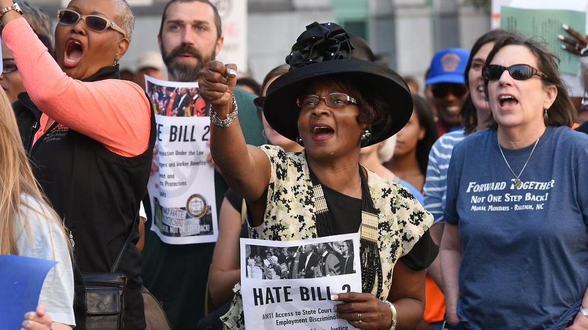 Protesters cheer after a speech at the Bicentennial Mall as members of the Moral Monday rally across the street from the legislative building Monday, May 16, 2016. Hundreds of protesters convened on the General Assembly to protest controversial HB2.