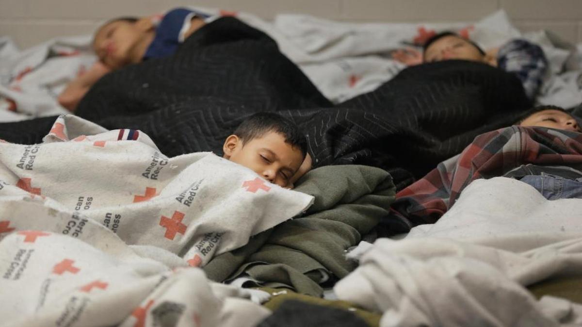 In this June 18, 2014, photo, children who’d been detained at the U.S. border slept at a processing facility in Brownsville, Texas. Fiscal year 2016 is on track to set a record for the number of families from Central America trying to cross the U.S. border.