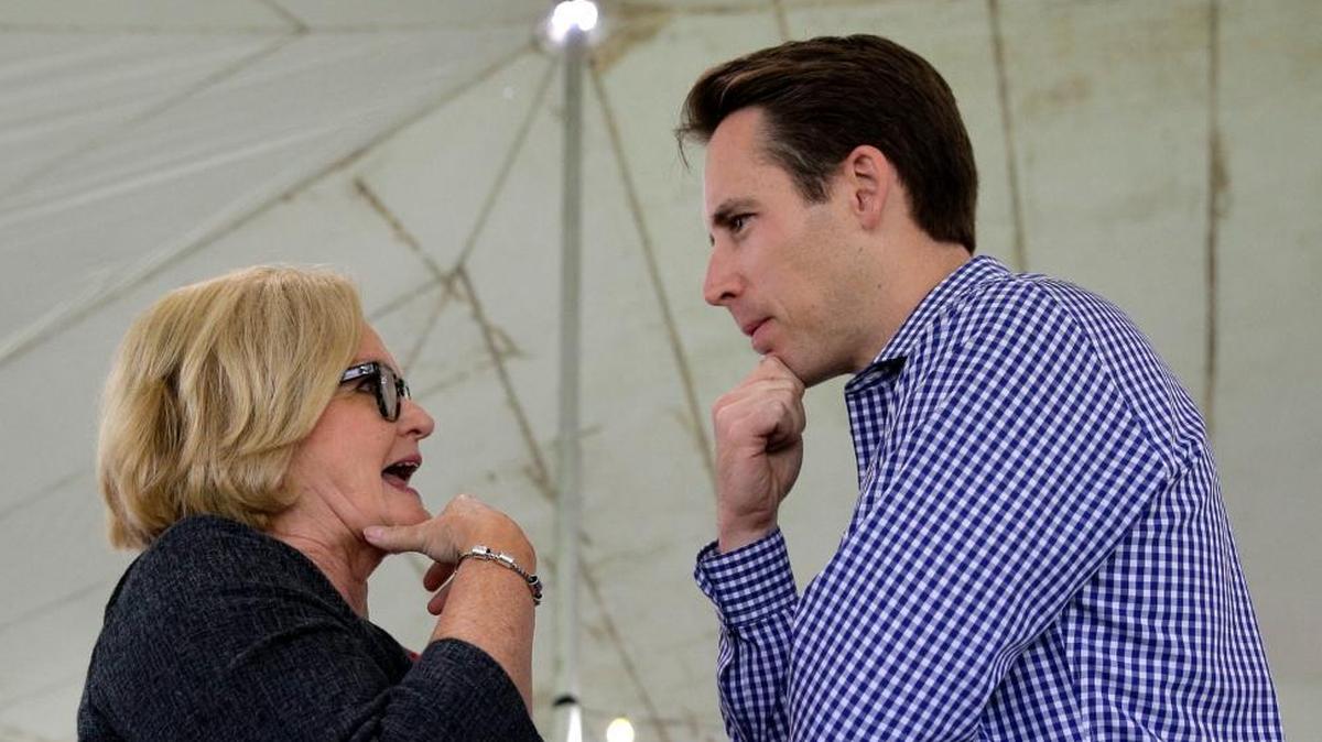 US. Sen. Claire McCaskill, D-Mo., talks with Missouri Attorney General and likely Republican challenger Josh Hawley during the Governor's Ham Breakfast at the Missouri State Fair in Sedalia, Mo