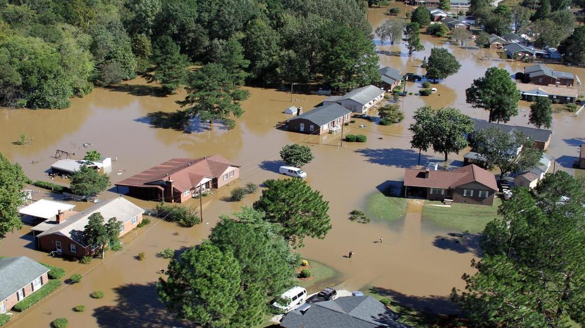 Flood waters surround several houses in Rocky Mount, N.C., near the Tar River Monday afternoon, Oct. 10, 2016. Heavy rains from Hurricane Matthew caused extensive flooding across eastern North Carolina last year.