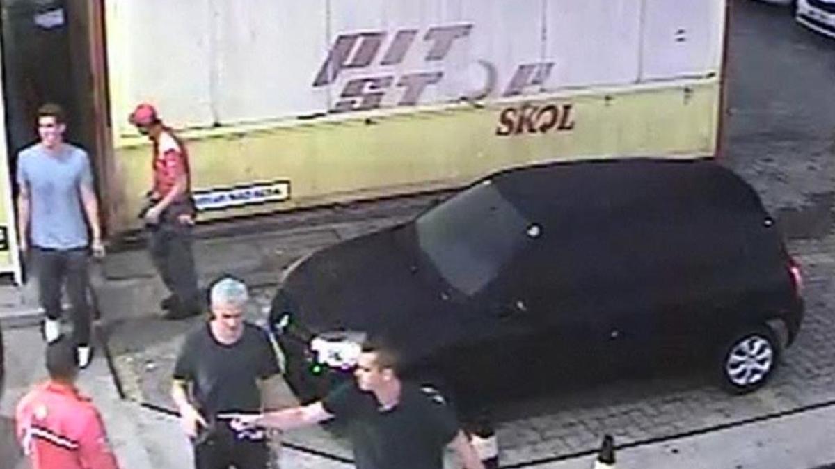 In surveillance video released by Brazil police, swimmer Ryan Lochte, second from right, of the United States, and teammates, appear at a gas station during the 2016 Summer Olympics. A top Brazil police official said the swimmers damaged property at the gas station.