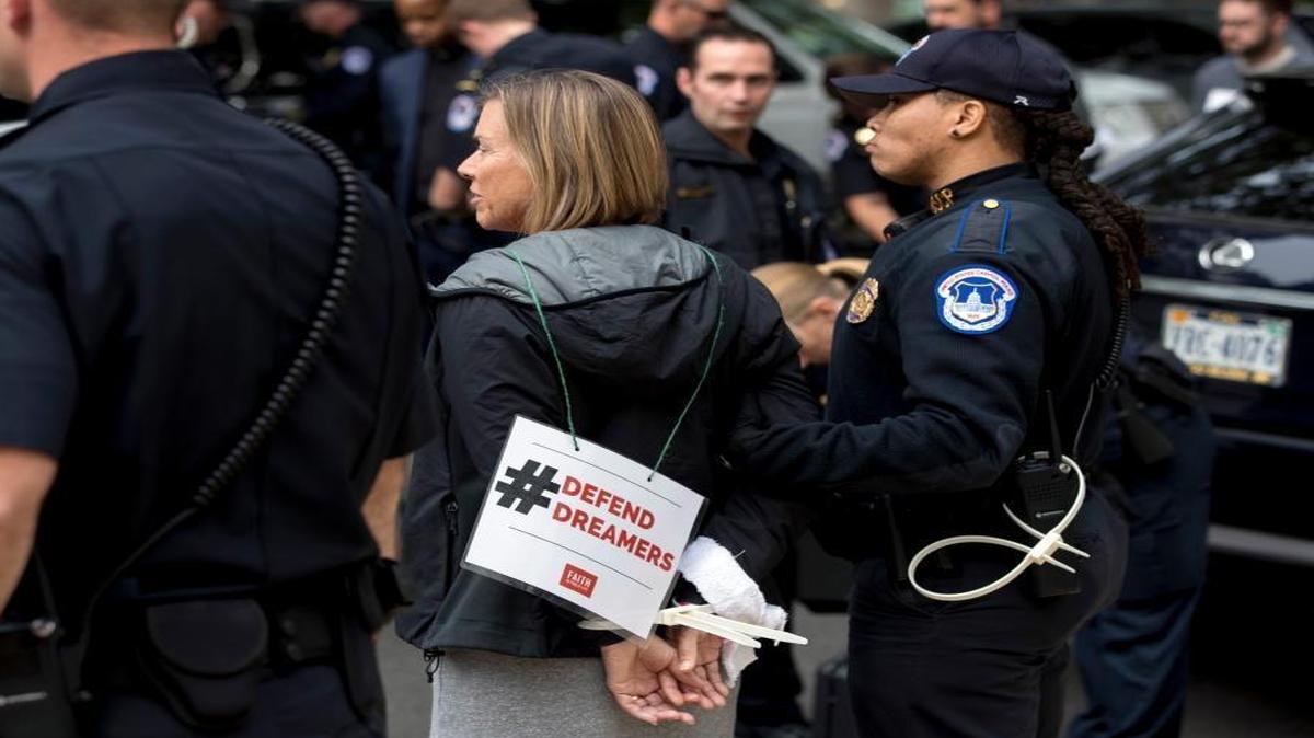 A group of religious leaders from across the country are arrested after protesting in support of the Dream Act on Capitol Hill Wednesday.