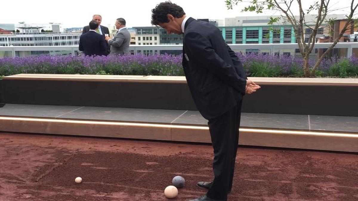 Paolo Toschi, head of congressional affairs and U.S. politics for the Italian embassy, examines the court at the fifth annual congressional bocce ball tournament hosted by the National Italian American Foundation on Wednesday, May 24, 2017, in Washington, D.C.