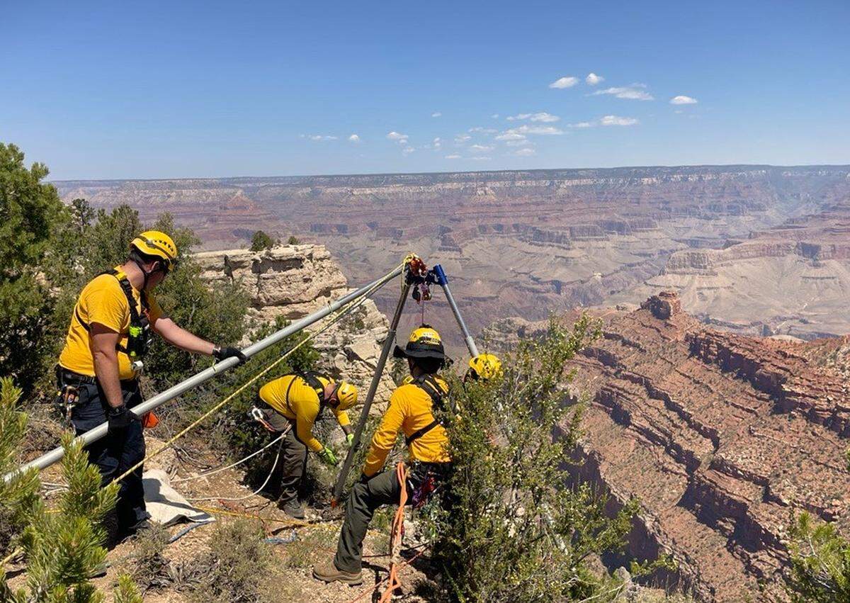 Rescuers are seen using a high angle technical rescue system after a 20-year-old fell into the Grand Canyon, officials said.