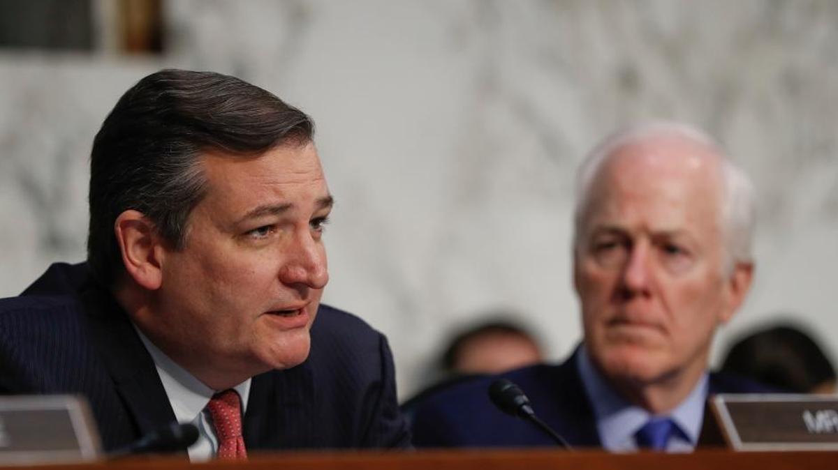 Sen. Ted Cruz, R-Texas, left, questions former Acting Attorney General Sally Yates and former National Intelligence Director James Clapper as Sen. John Cornyn, R-Texas, right, looks on.