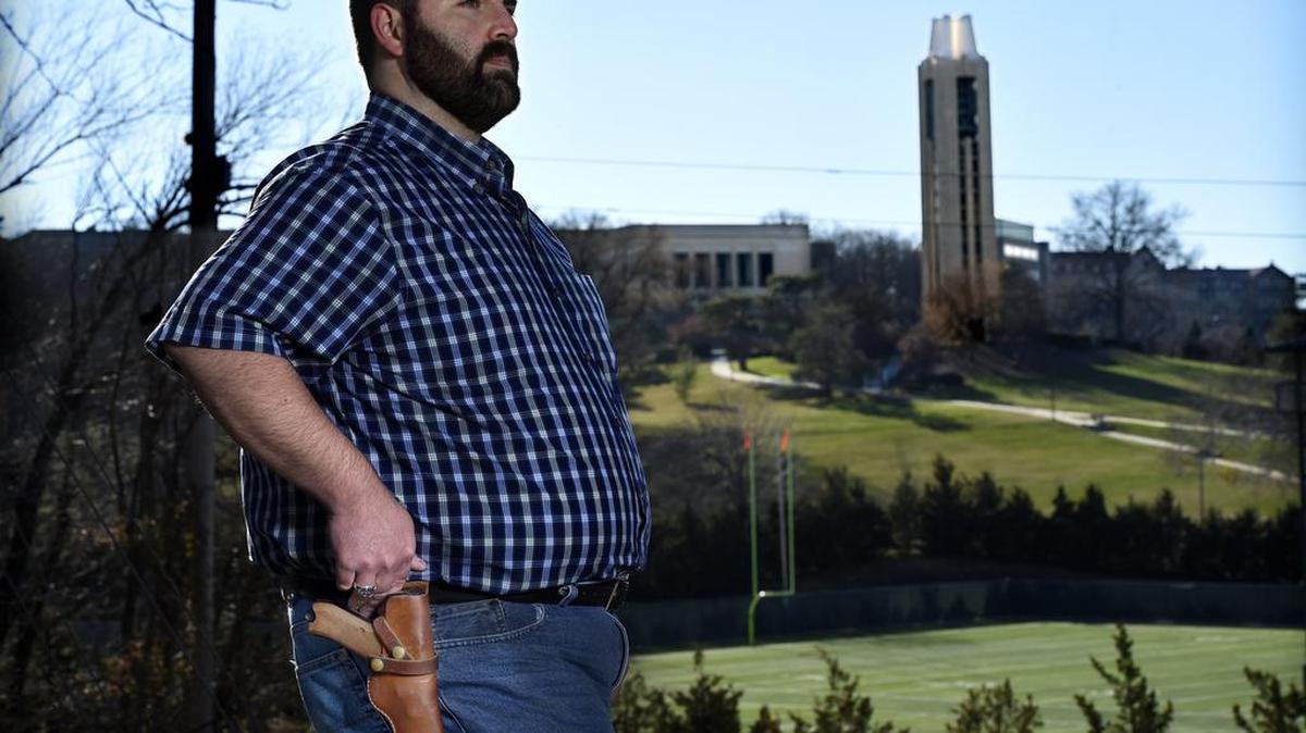 Joshua Young, a social work student at the University of Kansas, favors the right of students to carry firearms on campus.