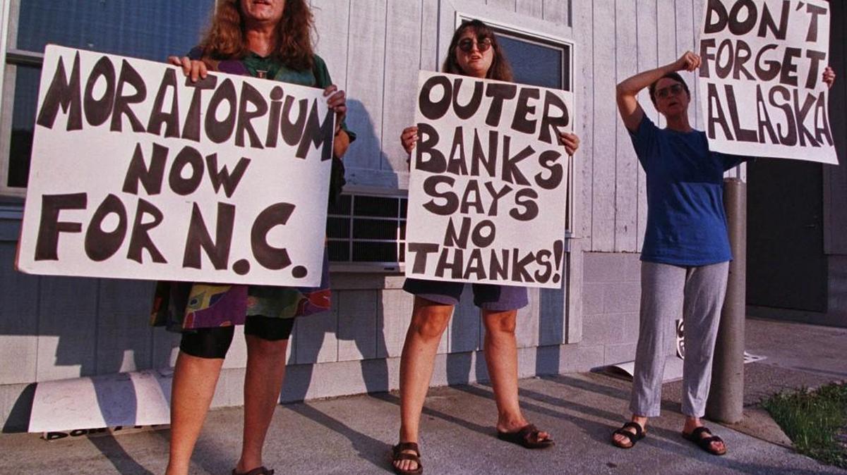 In this photo from 1998, people in Ocracoke were protesting ahead of a hearing on Chevron USA’s proposal to drill an exploratory oil and gas well about 40 miles offshore. Critics of advocates of drilling have been vocal since President Donald Trump in April issued an executive order to resume federal reviews for offshore drilling prospects.