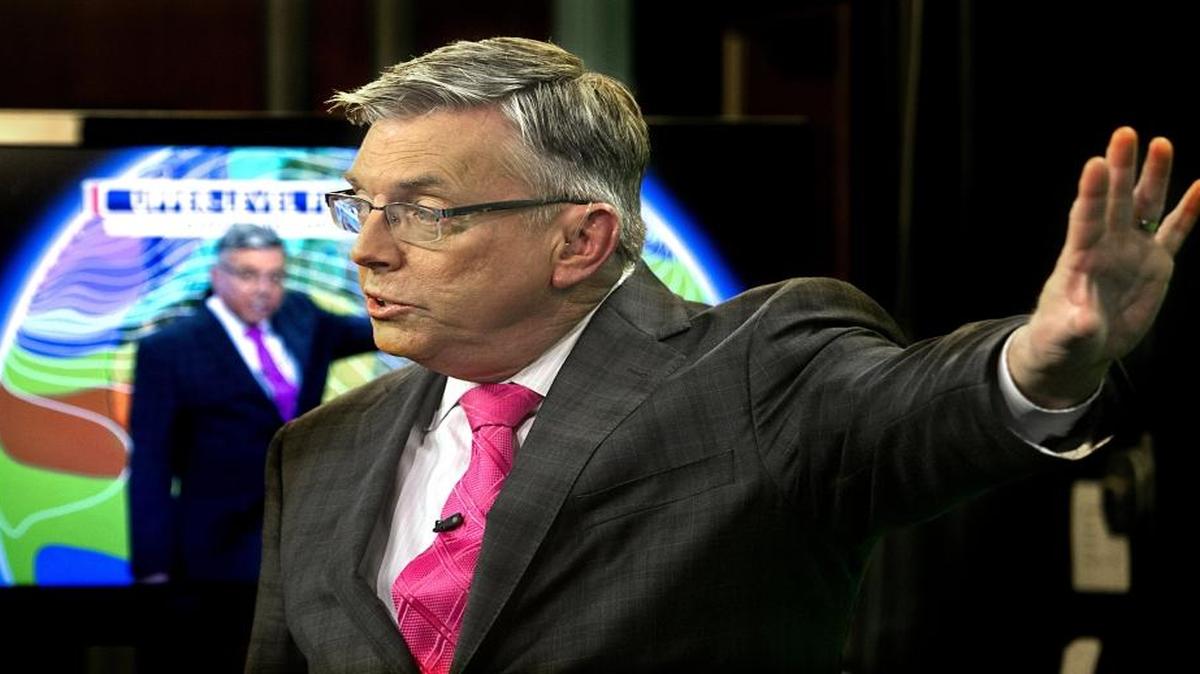 Meteorologist Greg Fishel, 58, works on-air during a late afternoon broadcast in the WRAL studio in Raleigh on Tuesday, December 8, 2015. He began his career in 1979 and has been with the station since 1981. His views on climate change have changed notably over those years. He now believes that humans do have a hand in the changing, global climate.