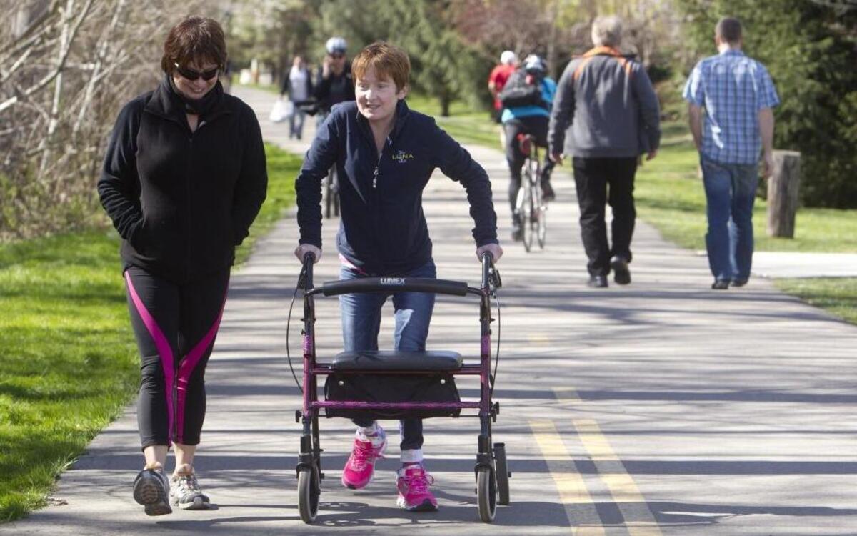 Rachel Corey, a triathlete who was hit by a car while bicycling in September 2014, goes for a walk and a chat with Teri Garcia.