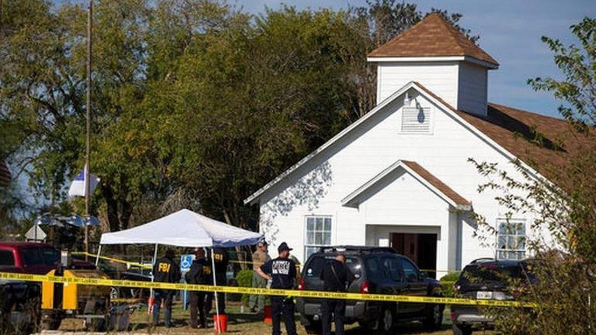 Law enforcement officials works at the scene of a fatal shooting at the First Baptist Church in Sutherland Springs, Texas, on Sunday, Nov. 5, 2017.